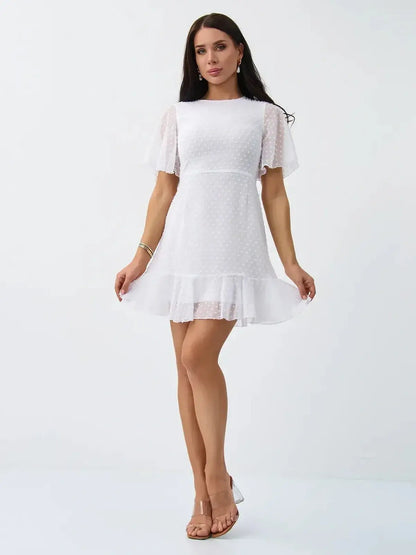 Starlight Ruffle Mini dress in white with polka dot texture, perfect for summer events and weddings.