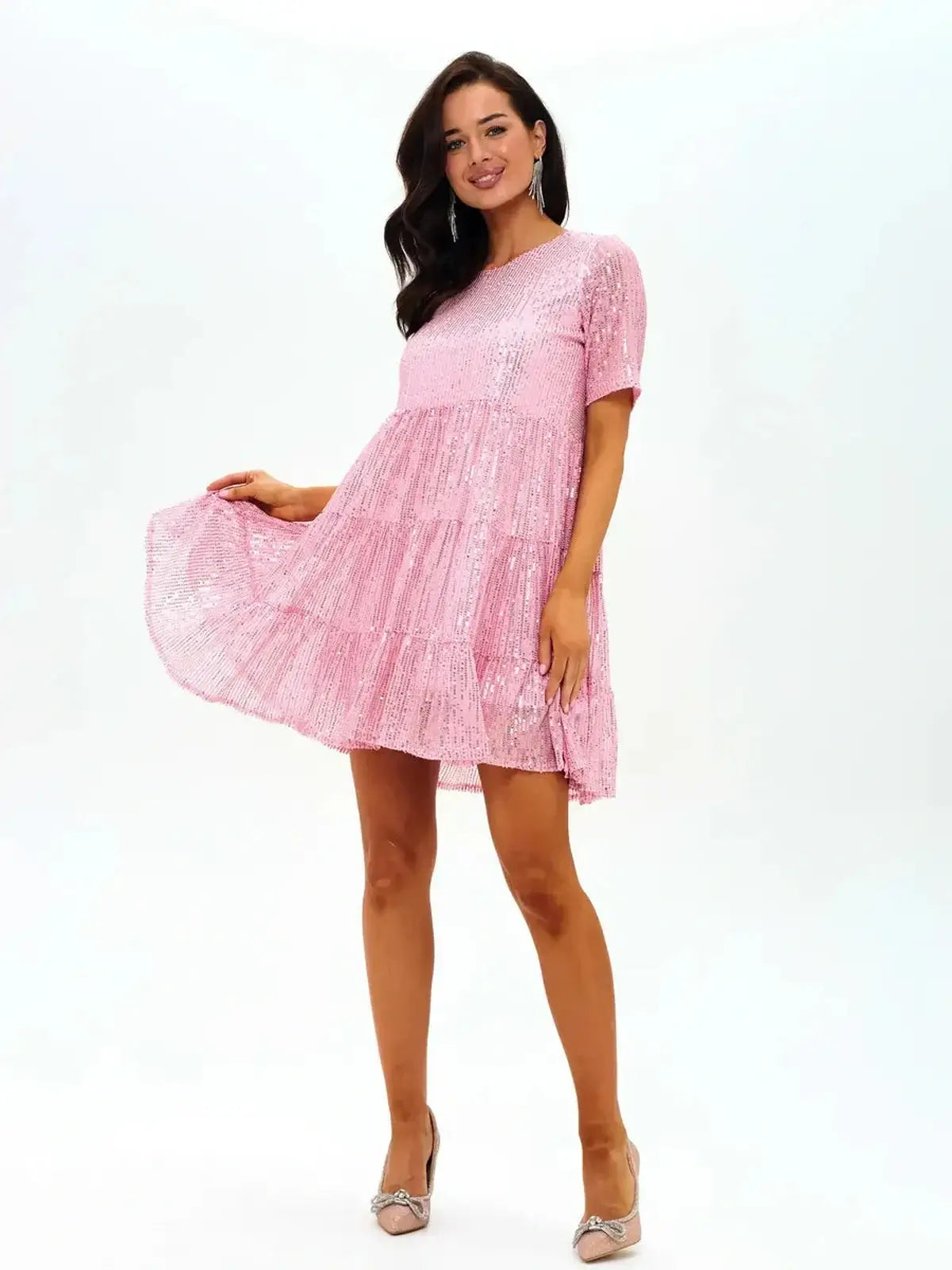 Sparkly pink tiered mini dress with short sleeves, perfect for parties or as a bridesmaid dress.