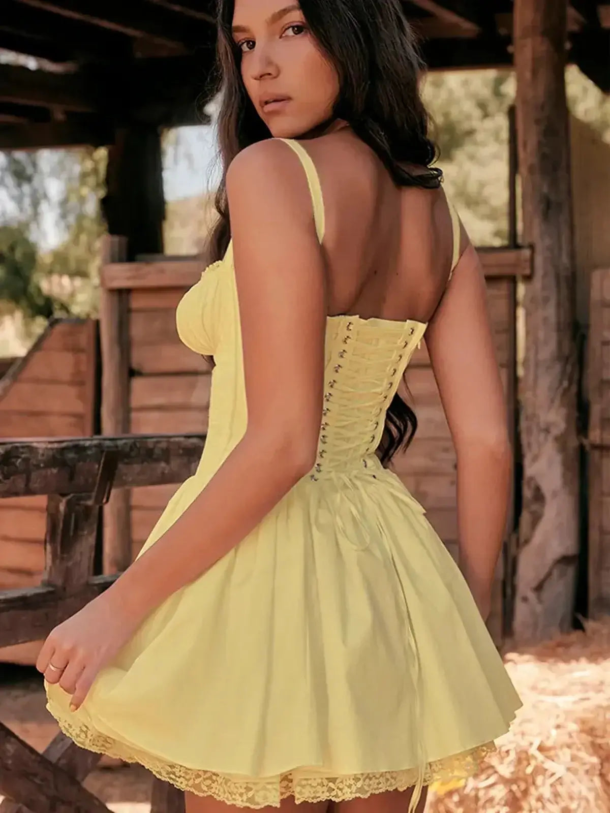 Yellow Sunlace Corset mini dress with lace-up back and flared skirt, perfect for summer or special occasions.
