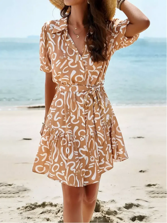 Sunstroke Mini Dress featuring a collared neckline and tiered skirt, perfect for summer beach outings.