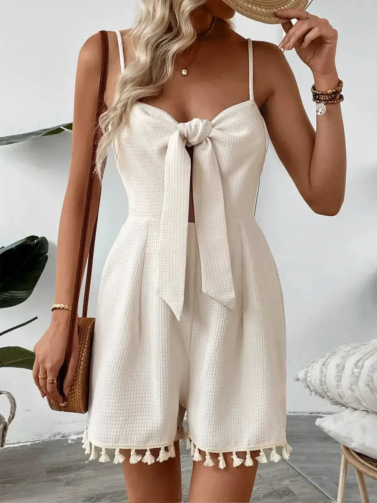 White tassel knot mini dress with sweetheart neckline, perfect for summer events and formal occasions.