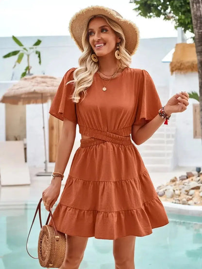 Terracotta flare mini dress with short flutter sleeves and gathered waist, perfect for summer outings and weddings.