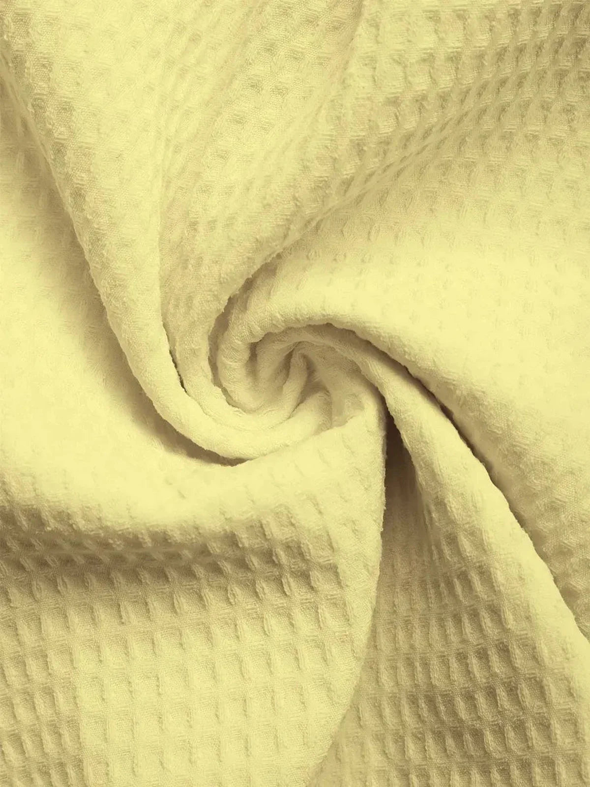 close-up of soft, textured, yellow fabric, ideal for summer dresses and comfortable clothing
