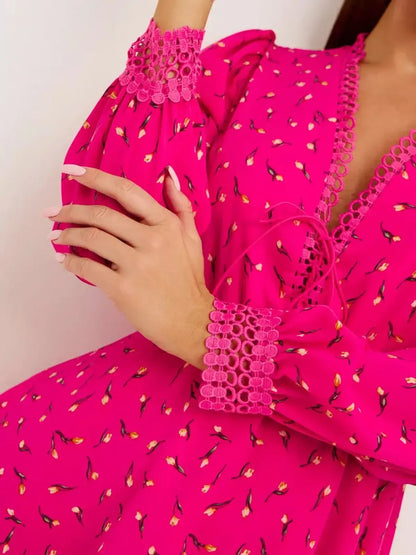Vibrant pink dress with floral print and lace trim, perfect for summer parties and special occasions.