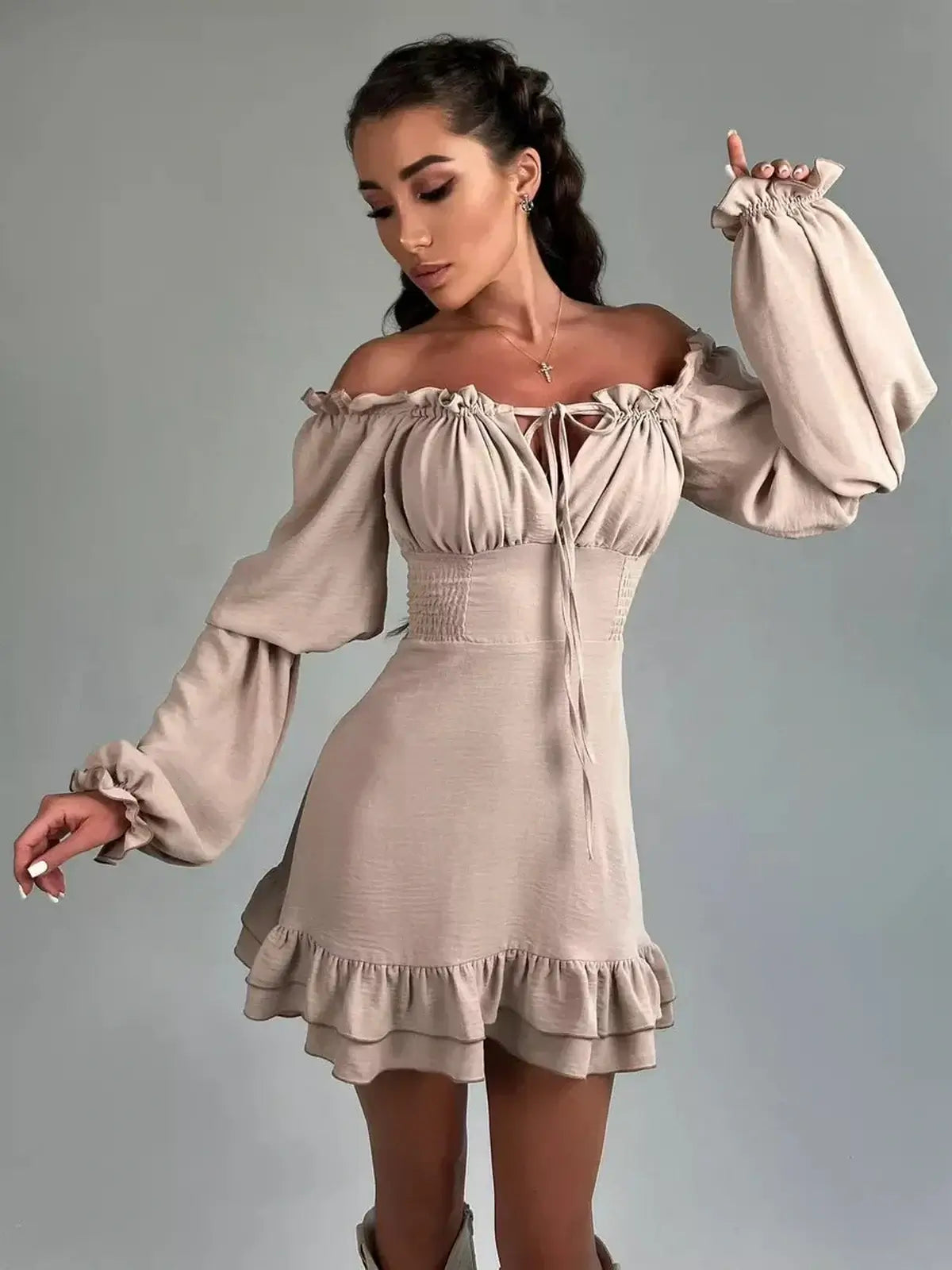 Velina Ruffle Mini off-shoulder dress with puffed sleeves and ruffled hem, perfect for summer parties and weddings.