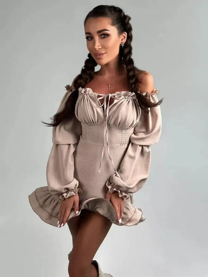 Velina Ruffle Mini off-shoulder dress with puffed sleeves and flounced hem, perfect for summer parties and weddings.