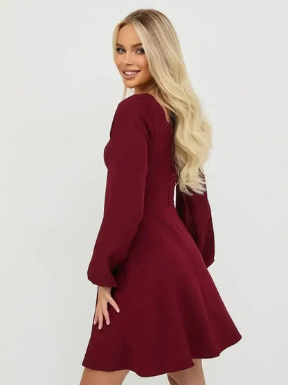 Long sleeve deep burgundy mini dress, perfect for parties and elegant occasions.