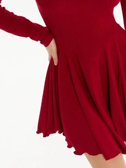 Close-up of a red mini dress with flared skirt, perfect for summer and formal occasions.
