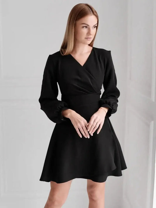 Black midi dress with V-neckline and puff sleeves, perfect for weddings or formal occasions.