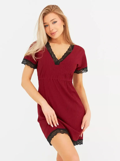 Model wearing Velvet Hour mini dress in rich red with black lace trim and flutter sleeves, perfect for wedding guest or cocktail events.