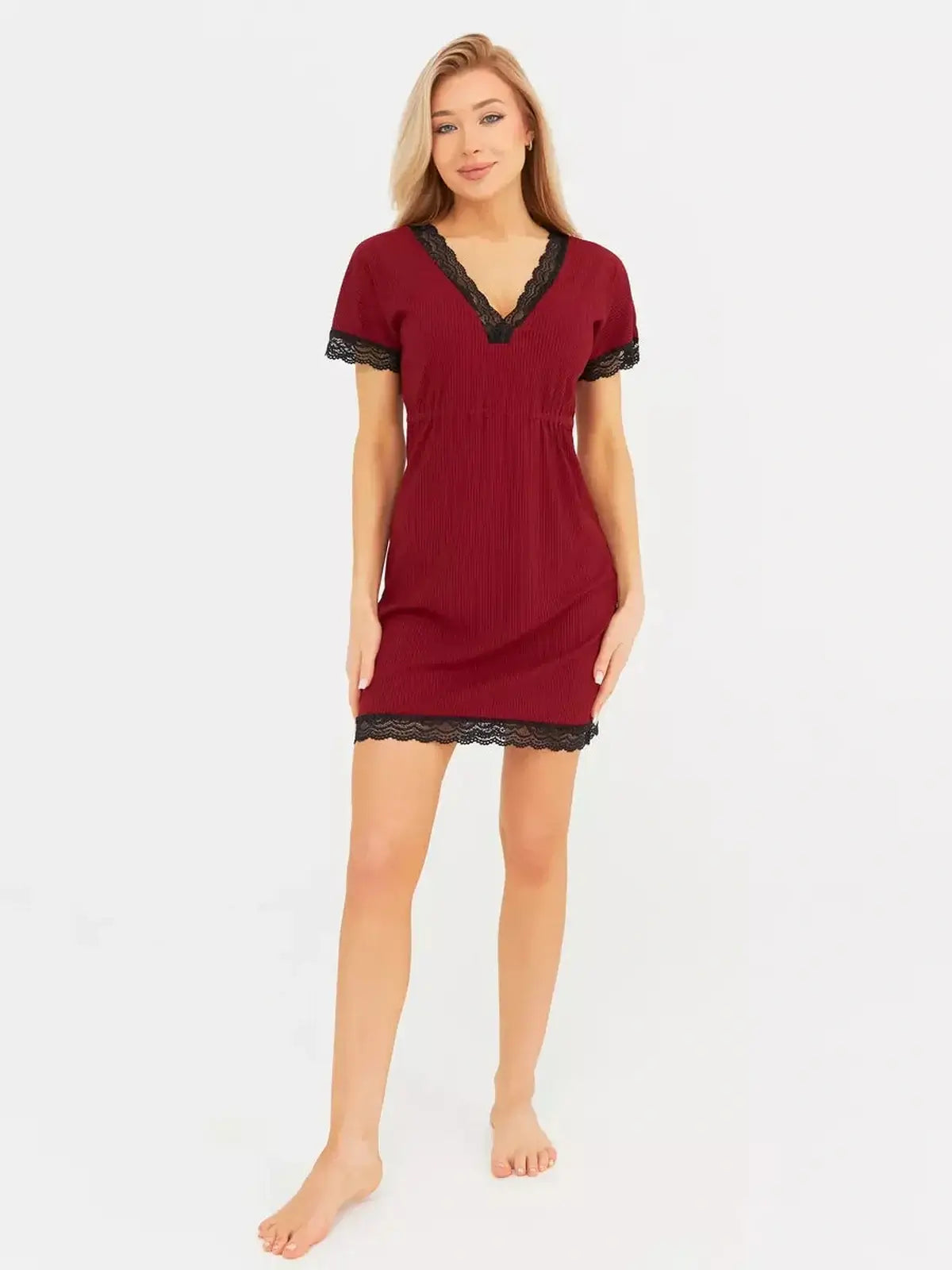 Elegant red velvet mini dress with black lace trim, perfect for cocktail events or wedding guest attire.