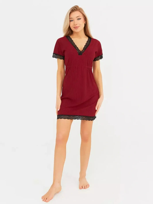 Elegant red velvet mini dress with black lace trim, perfect for cocktail events or wedding guest attire.
