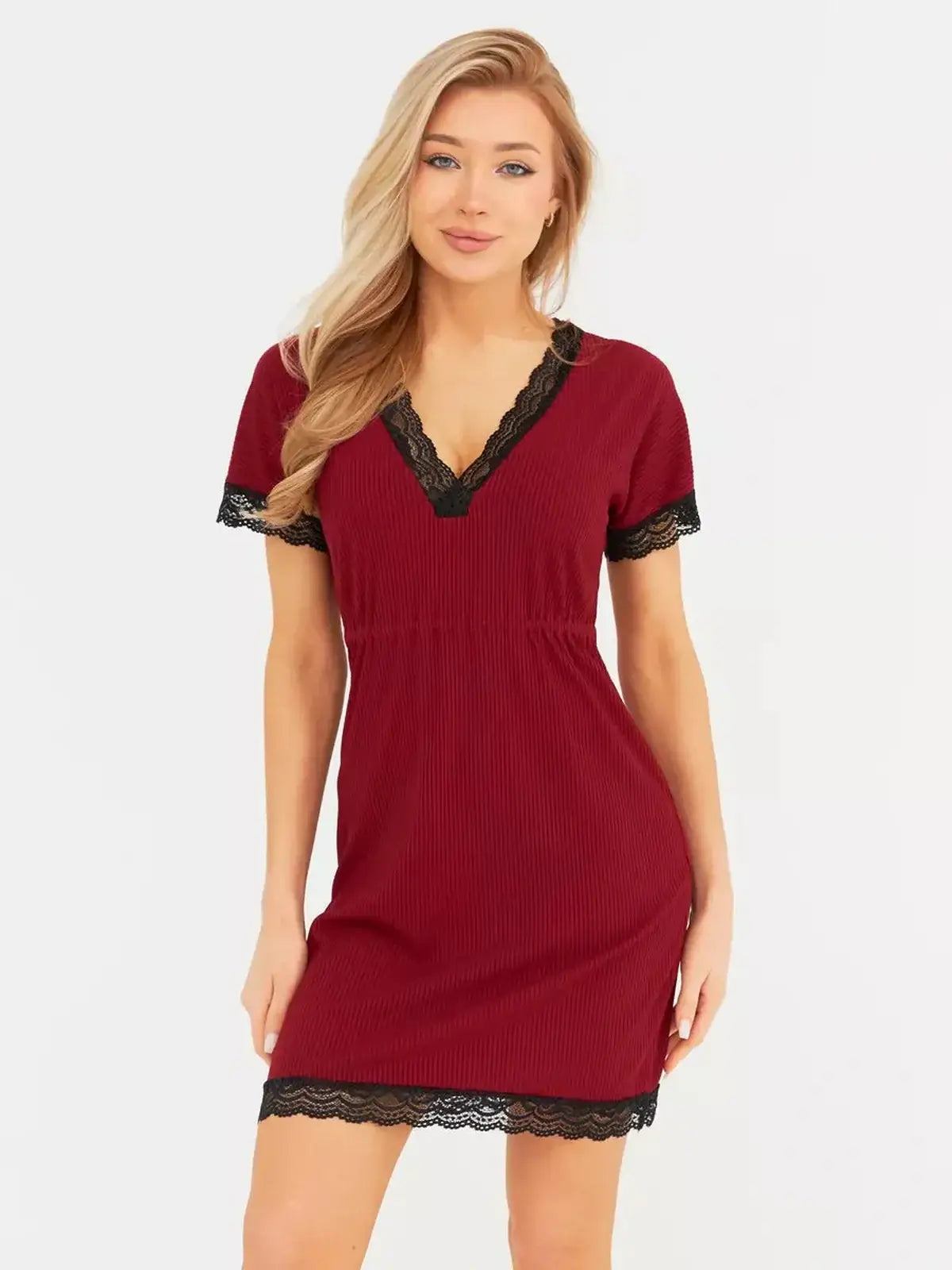 Model wearing a red Velvet Hour mini dress with black lace trim and flutter sleeves, perfect for weddings or cocktail events.