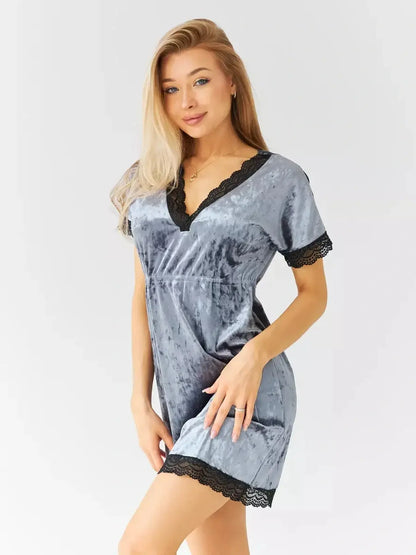 Model wearing a sultry grey velvet mini dress with black lace trim, perfect for cocktail parties and summer events.