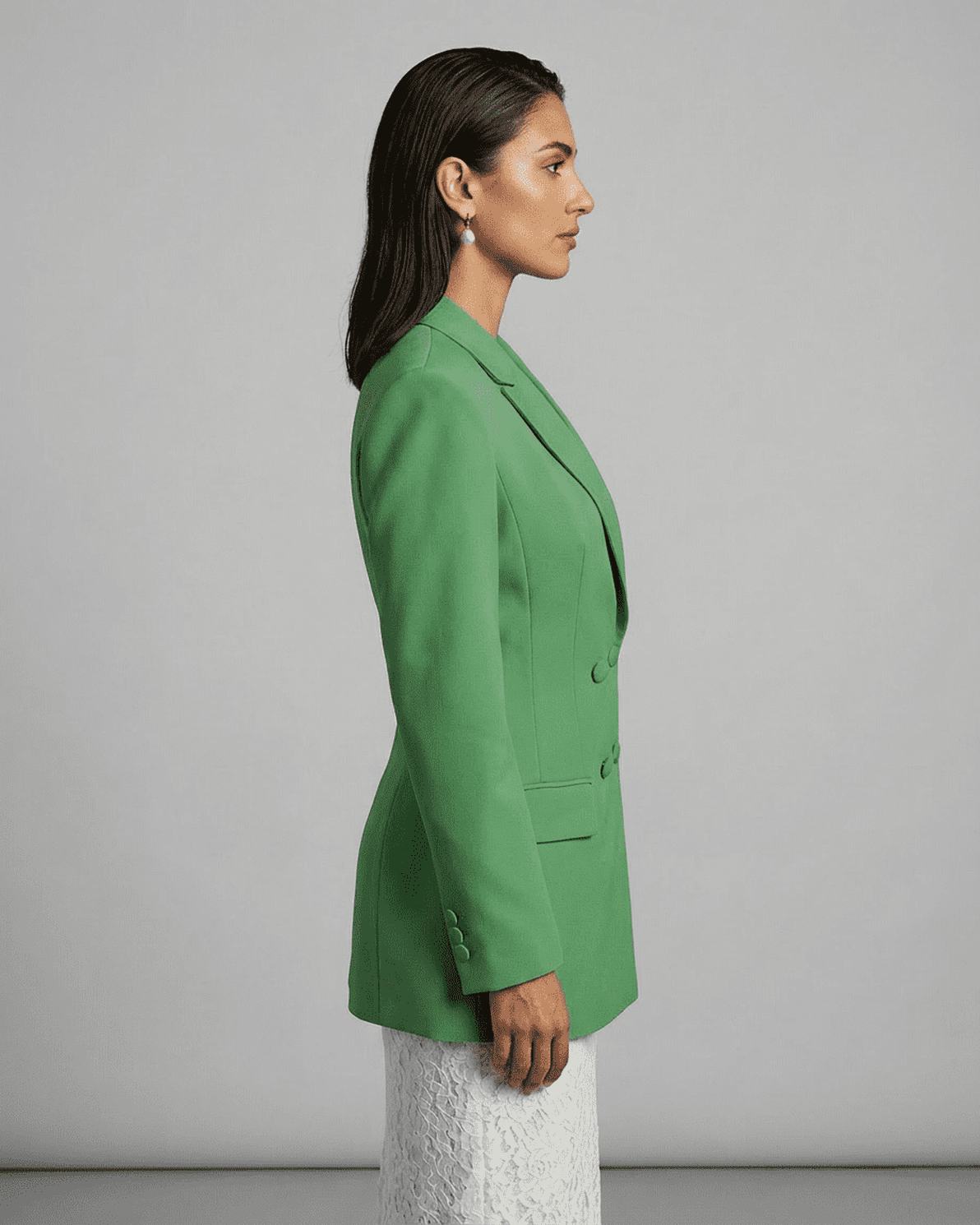 Verona Blazer by Slimona, showcasing a side view of a green double-breasted tailored silhouette.
