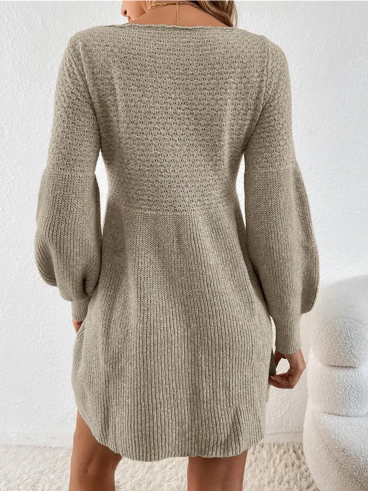 Cozy long sleeve knit mini dress in soft taupe color, perfect for autumn and winter elegance.