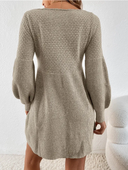 Cozy long sleeve knit mini dress in soft taupe color, perfect for autumn and winter elegance.
