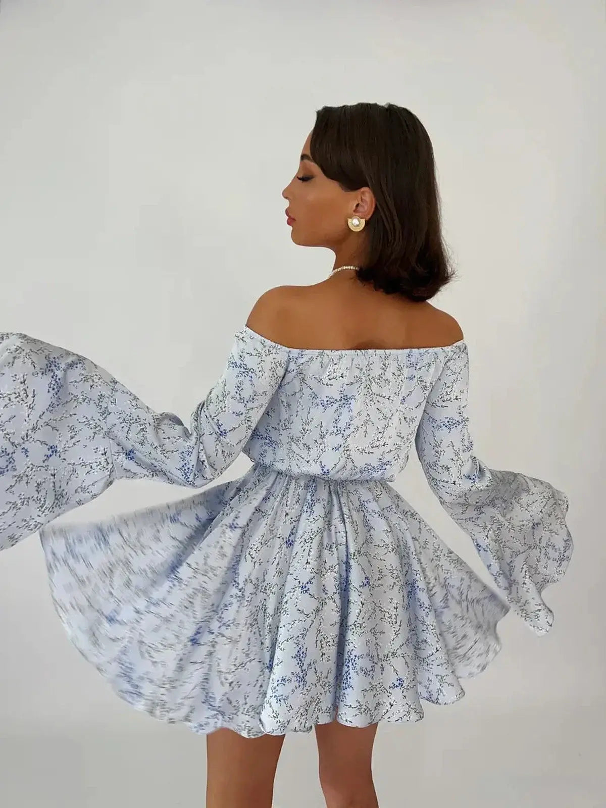 Whimsy Flair Mini Dress with off-shoulder neckline and bell sleeves, perfect for summer, weddings, and cocktail events.