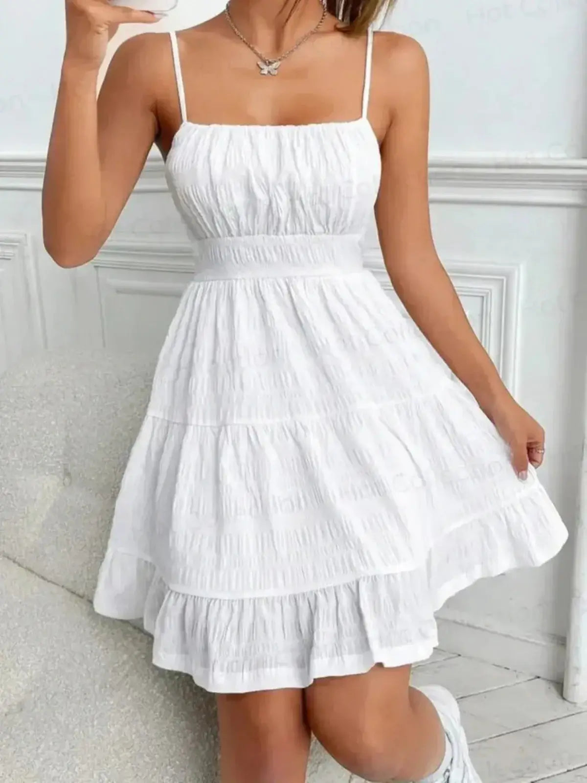White Whisper Charm Mini Dress with spaghetti straps and tiered skirt, perfect for summer occasions and weddings.