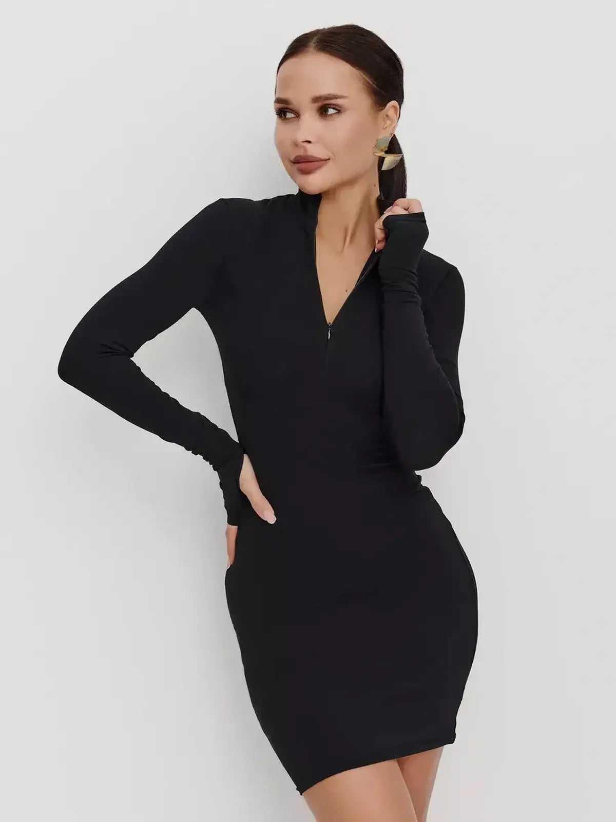 Black Zip Form Mini Dress featuring long sleeves and a zip-front closure, perfect for wedding guest or cocktail events.